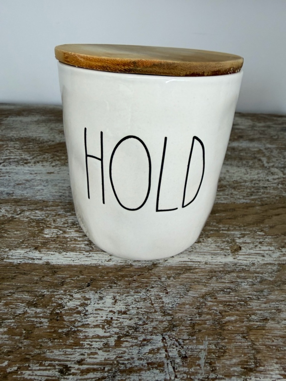 Rae Dunn White Ceramic Jar with Black 'HOLD' Lettering and Wood Lid